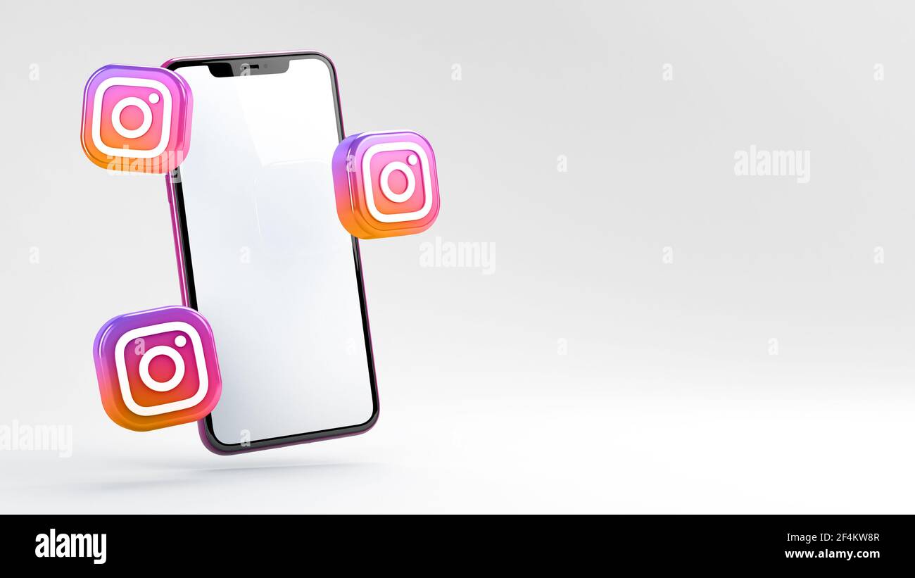 Valencia, Spagna - Marzo, 2021: Logo Instagram isolato con un telefono cellulare a schermo vuoto. Instagram è un'applicazione gratuita di social media per condividere foto e Foto Stock