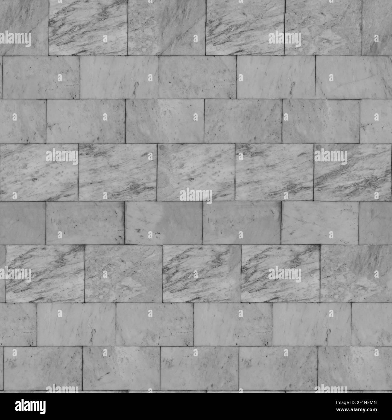 Bianco-grigio con striature marroni. Struttura senza cuciture di piastrelle di marmo sulla parete. Foto Stock