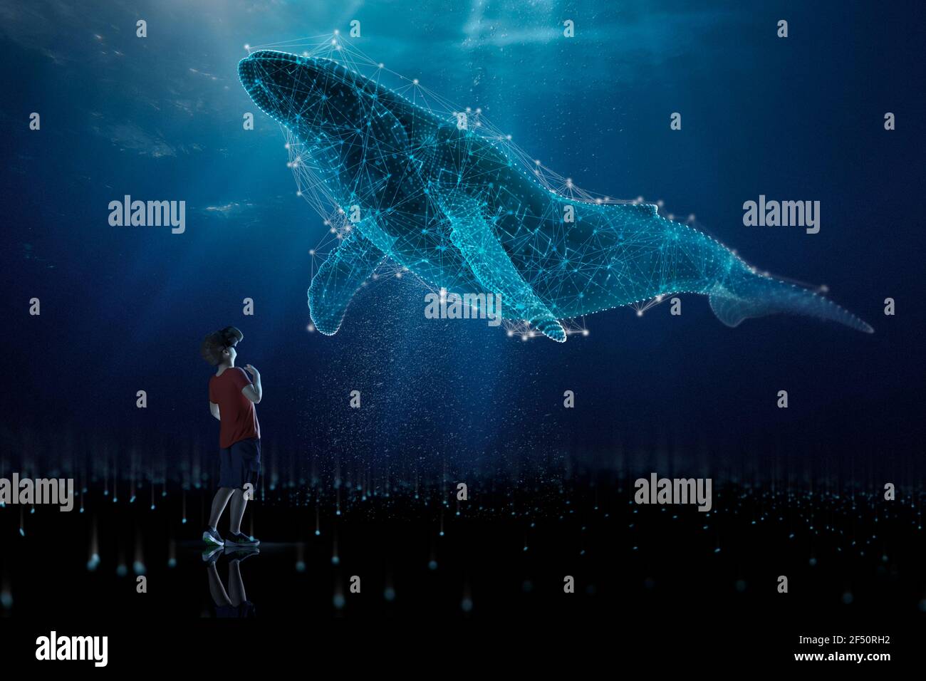 Un ragazzo curioso in visore VR che guarda in alto alla megattere olografica balena Foto Stock