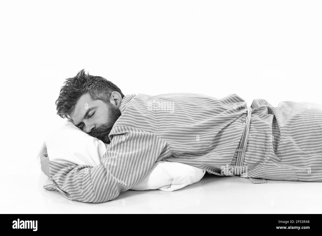 Uomo con sonno peloso, sonno pesante, fondo bianco. Foto Stock