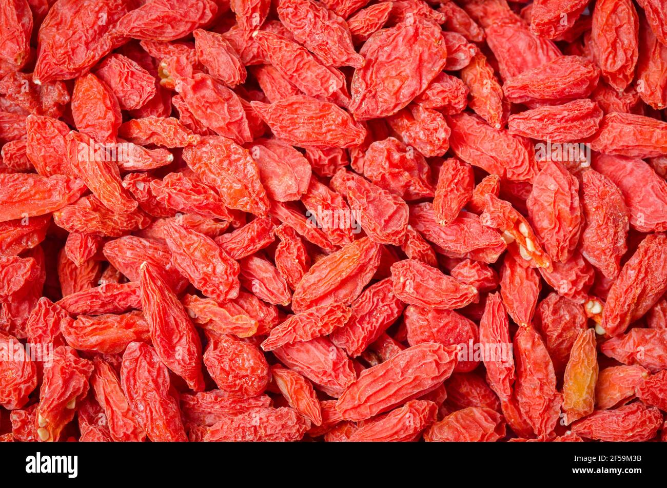 Sfondo di frutti di bosco cinesi secchi o bacche di goji. Foto Stock