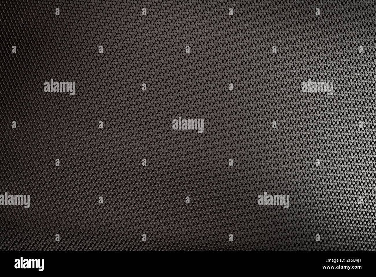 texture esagonale metallizzata con luce brillante su di essa Foto Stock