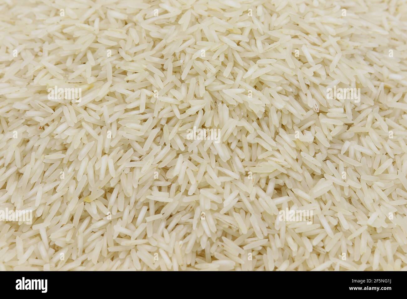 riso bianco dettaglio trama sfondo, primo piano dello sfondo del riso Foto Stock
