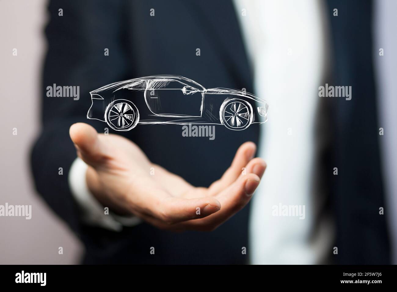 Uomo d'affari con gesto di dare e icona di auto. Foto Stock