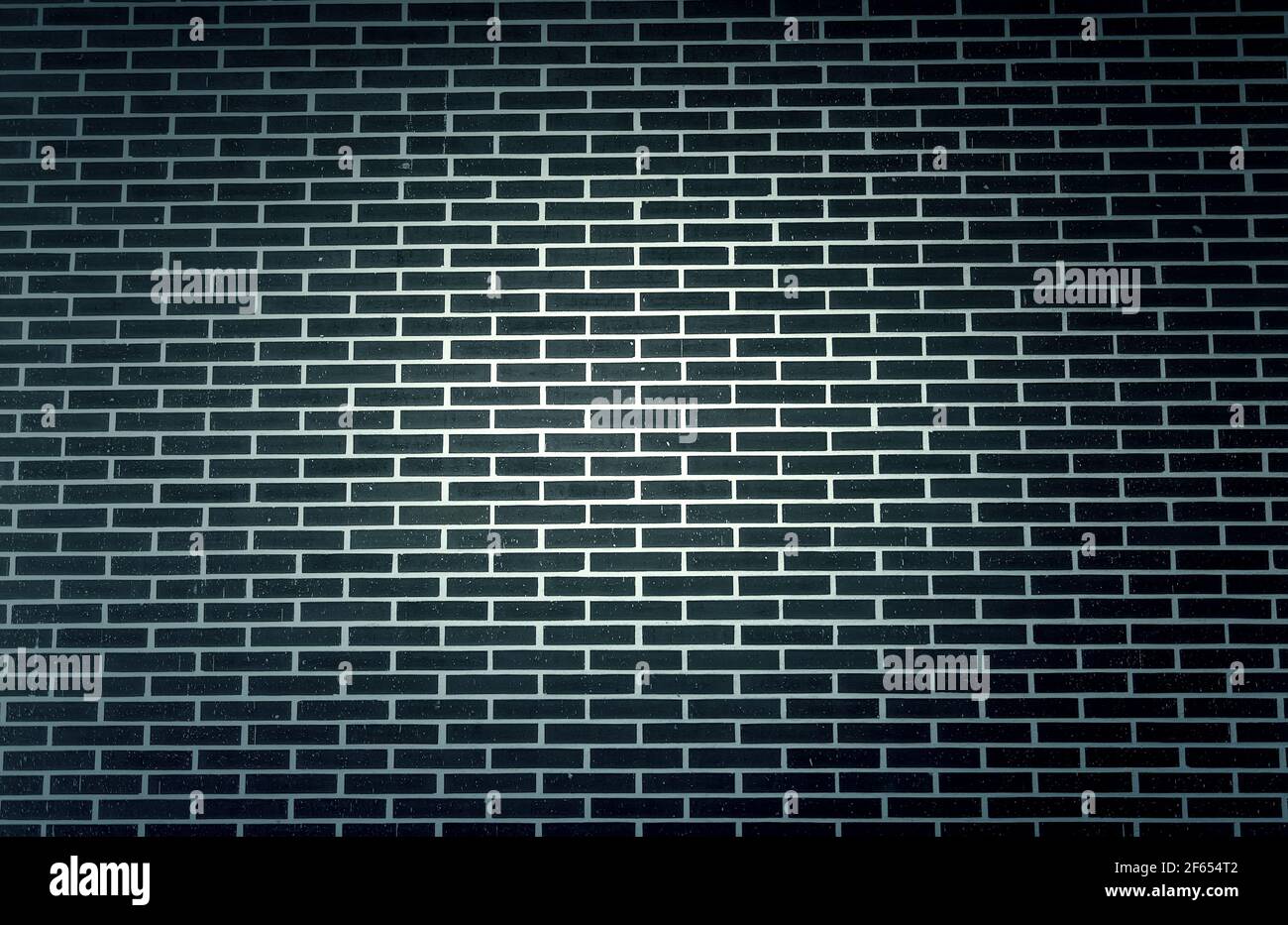 Muro di mattoni scuri in edificio, costruzione e architettura, struttura Foto Stock