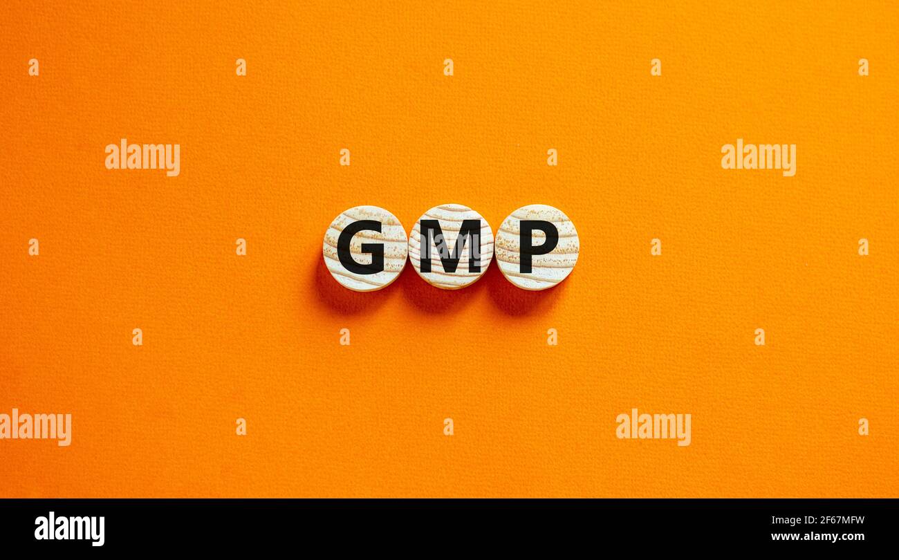GMP, simbolo di buona pratica di fabbricazione. Concetto parole GMP, buona pratica di fabbricazione su cerchi su uno sfondo arancione bello. Business e GMP, Foto Stock