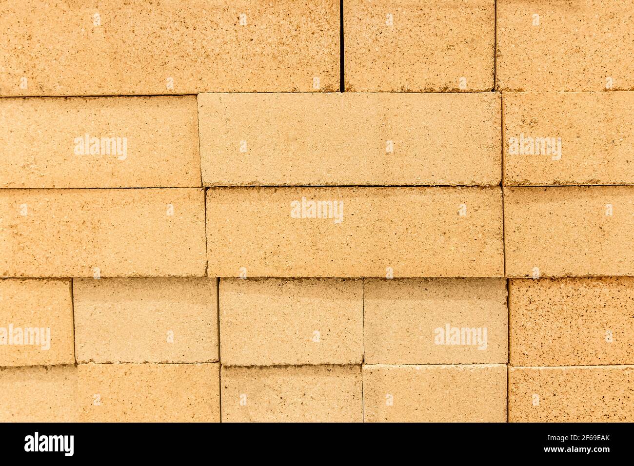 Texture di mattoni refrattari color sabbia closeup parete blocchi, sfondo  Foto stock - Alamy
