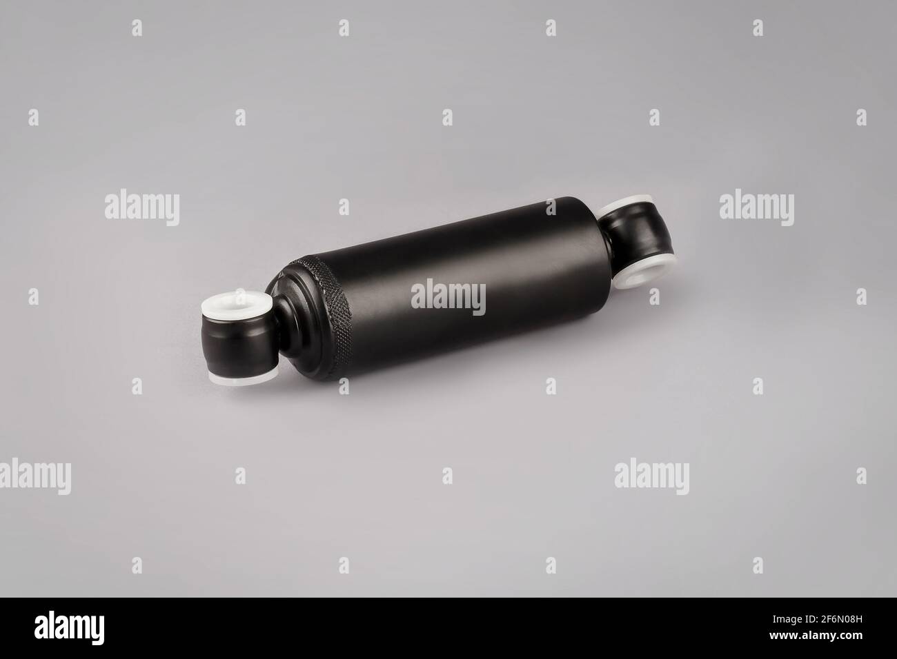 Ammortizzatore sedile del carrello su sfondo grigio. Camion ammortizzatore cabina, ricambi auto, ricambi Cabinedemper. Ammortizzatore su un backgrou grigio Foto Stock