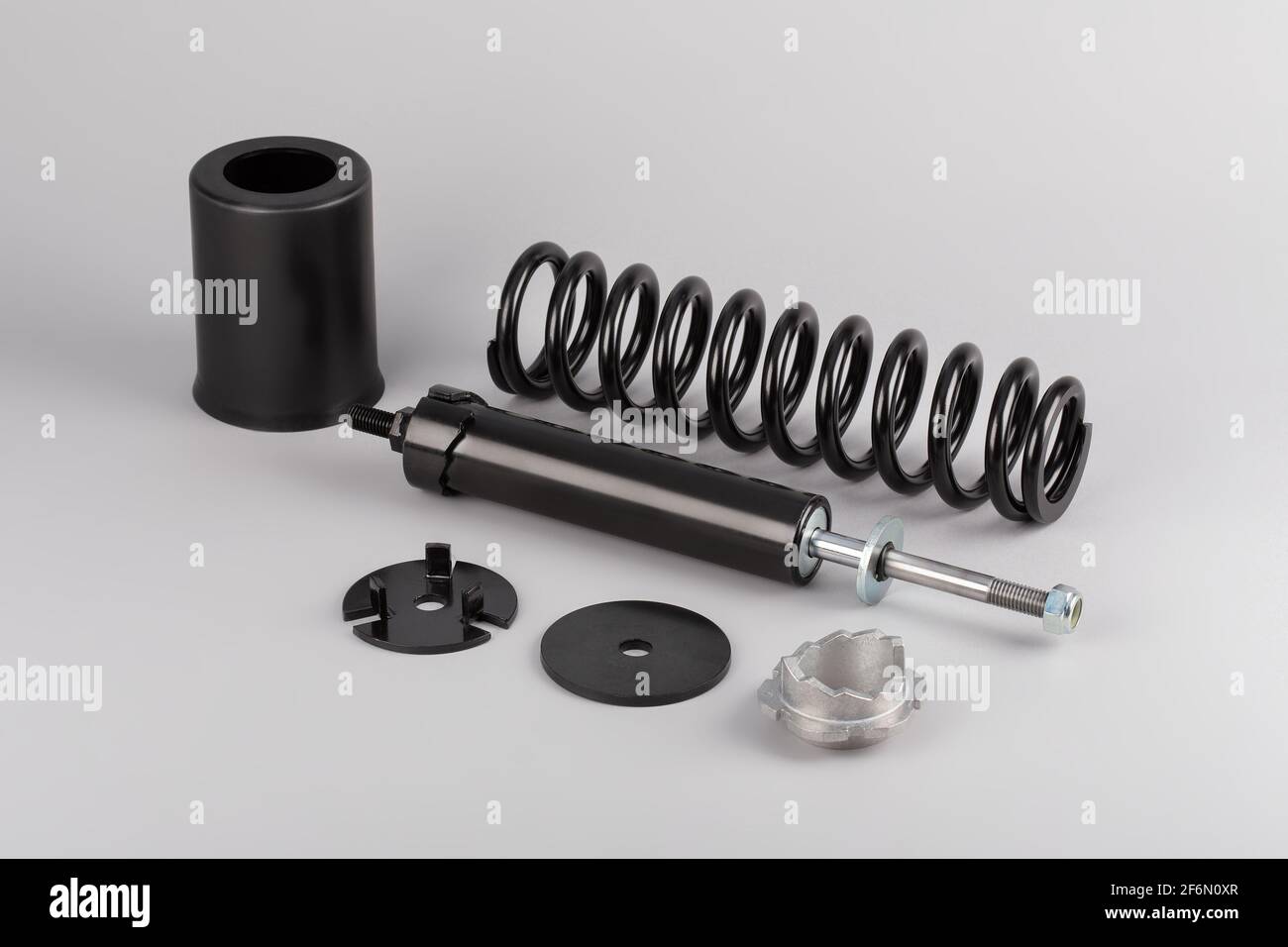 Camion ammortizzatore cabina, ricambi auto, ricambi Cabinedamper. Ammortizzatore su fondo grigio. Foto Stock