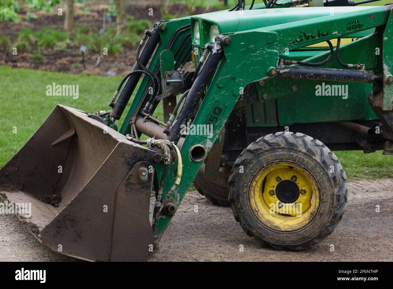 Primo piano di un trattore compatto / mini digger Foto Stock