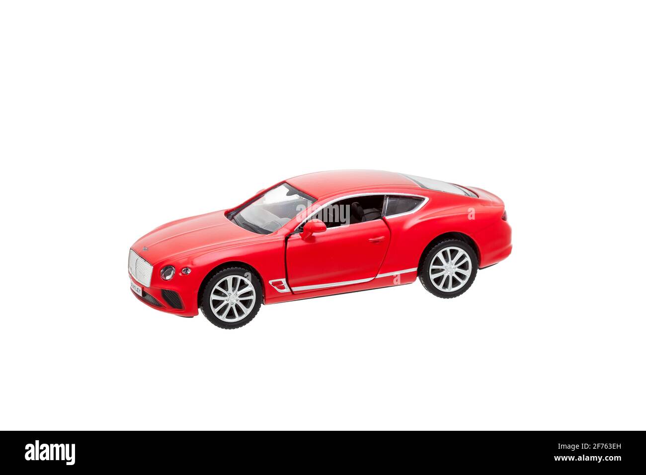 Odessa, Ucraina - 10 gennaio 2021: Il Bentley Continental gt Coupé rosso giocattolo auto costoso hobby maschile, oggetto infantile isolato su bianco backgro Foto Stock