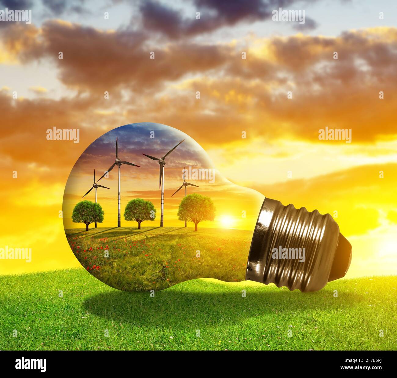 Turbine eoliche in lampadina al tramonto. Il concetto di risorse sostenibili. Foto Stock