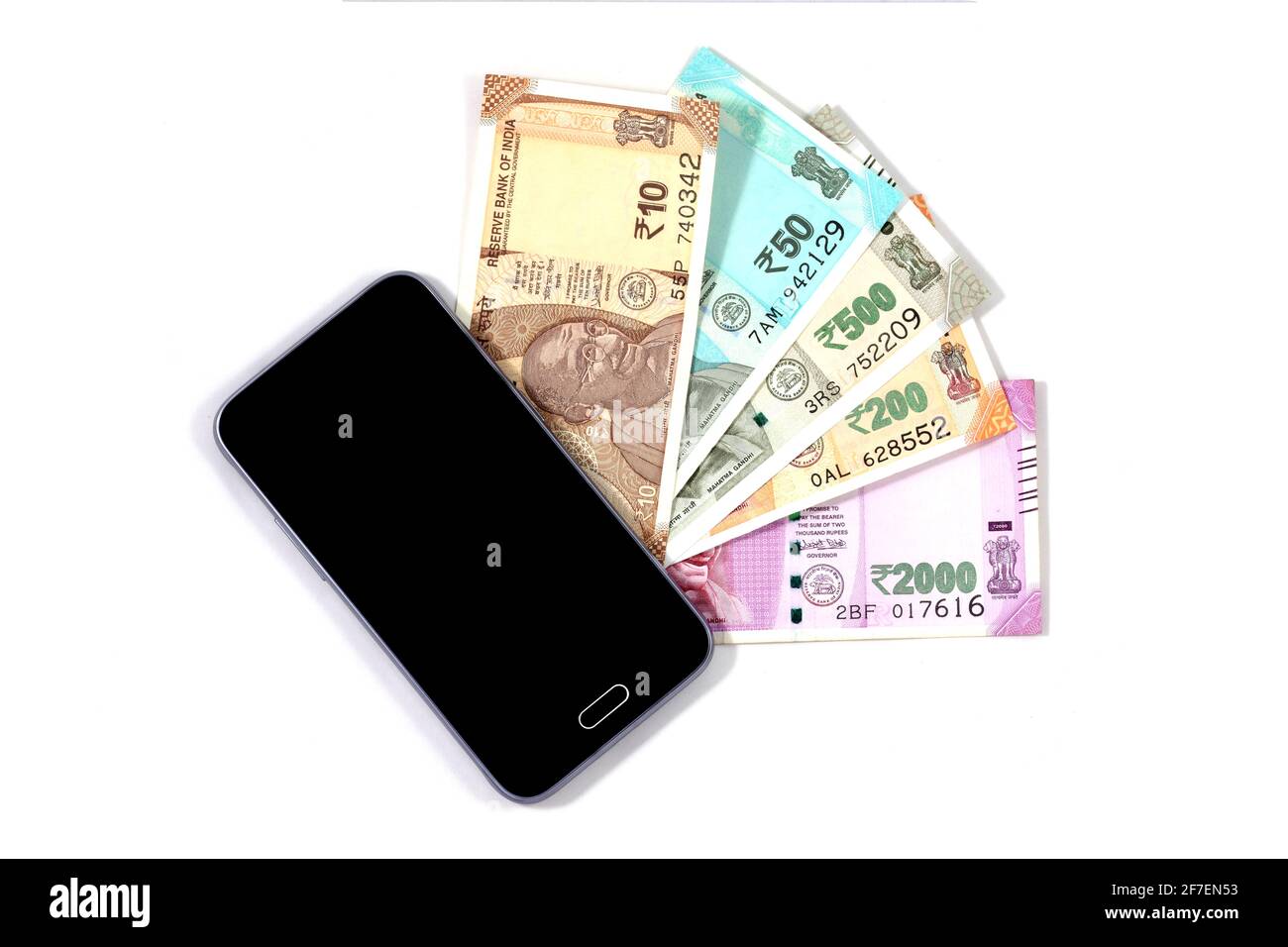 Smartphone mobile e note rupia indiana, denaro digitale, fin-tech, soldi facendo online concetti Foto Stock