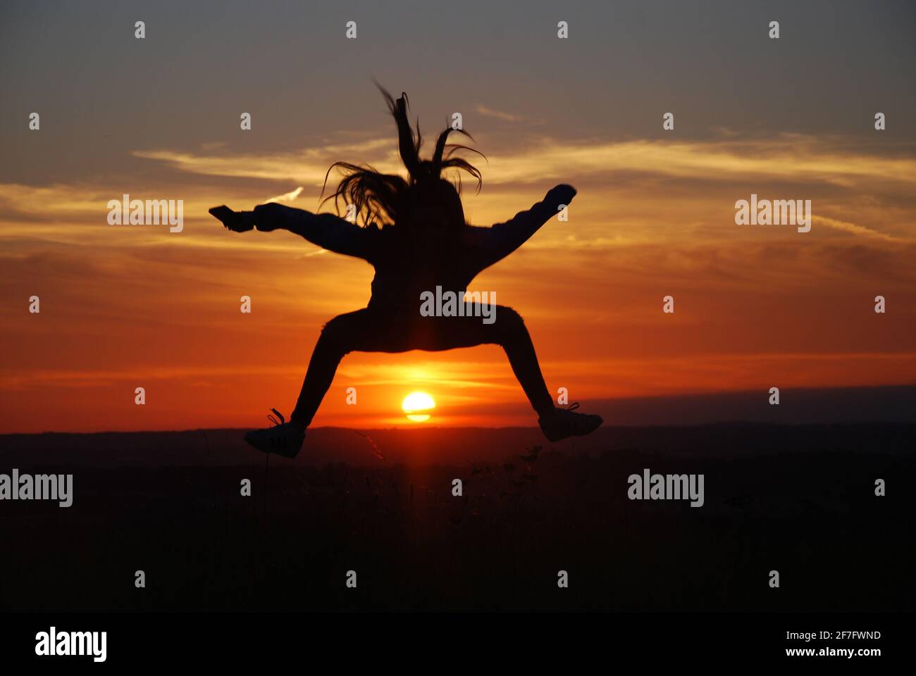 Salto al tramonto Foto Stock