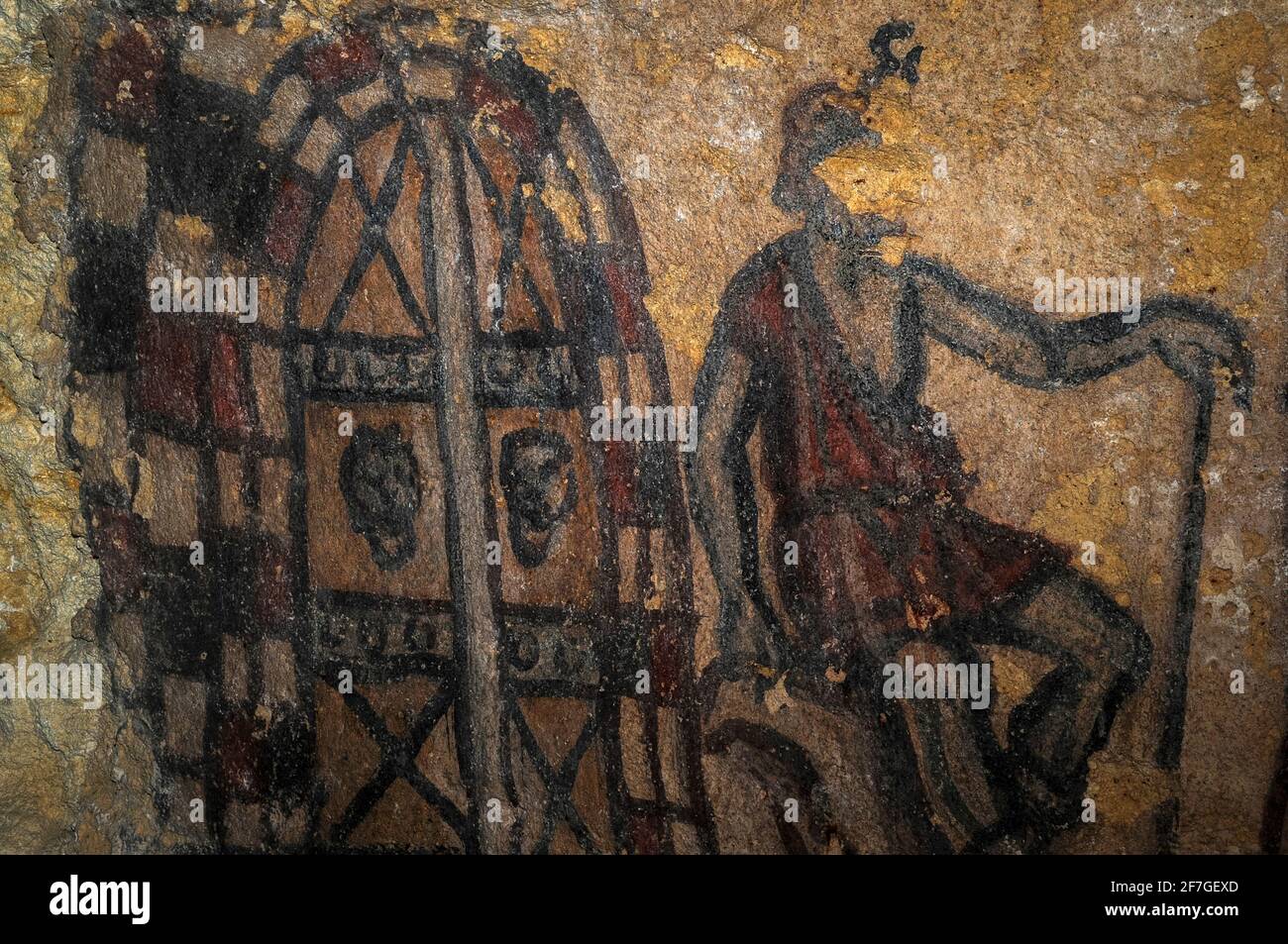 Il demone etrusco Charun si siede con una mano appoggiata sul lungo manico  del suo martello simbolico mentre custodisce l'ingresso dell'Underworld, In  questo particolare di un dipinto murale della fine del III