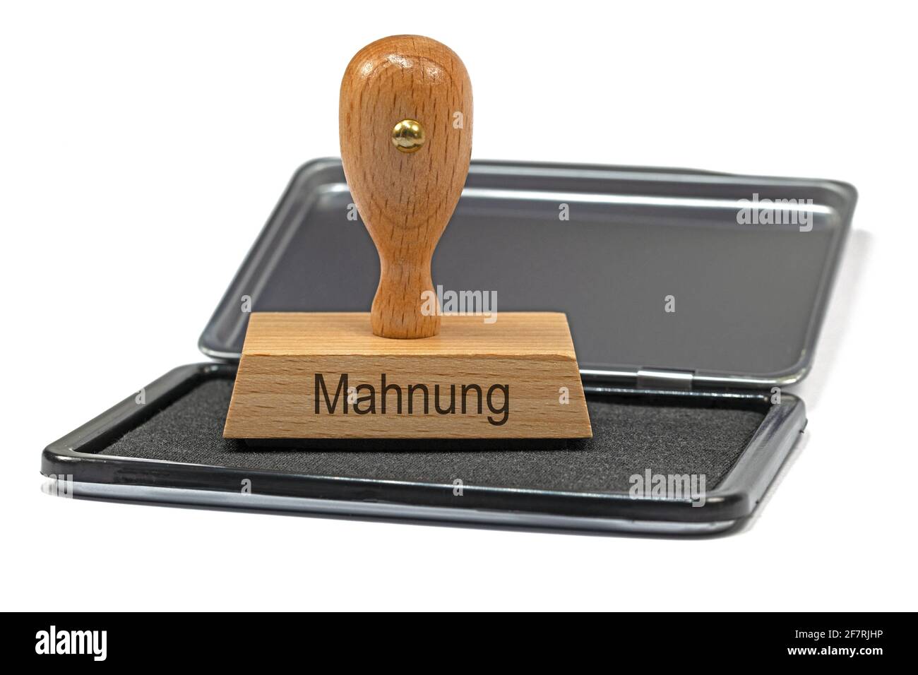 Francobollo in legno con l'iscrizione "Mahnung", traduzione "Promemoria" Foto Stock