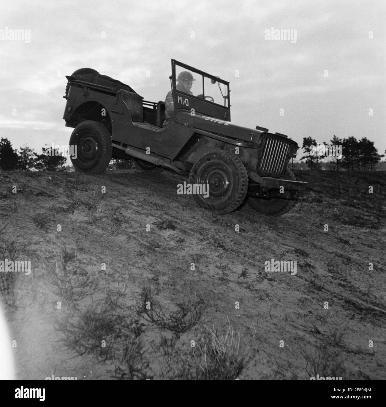 Esercizio sul sito con Willys Jeep, scuola di moto l'Aia. Foto Stock