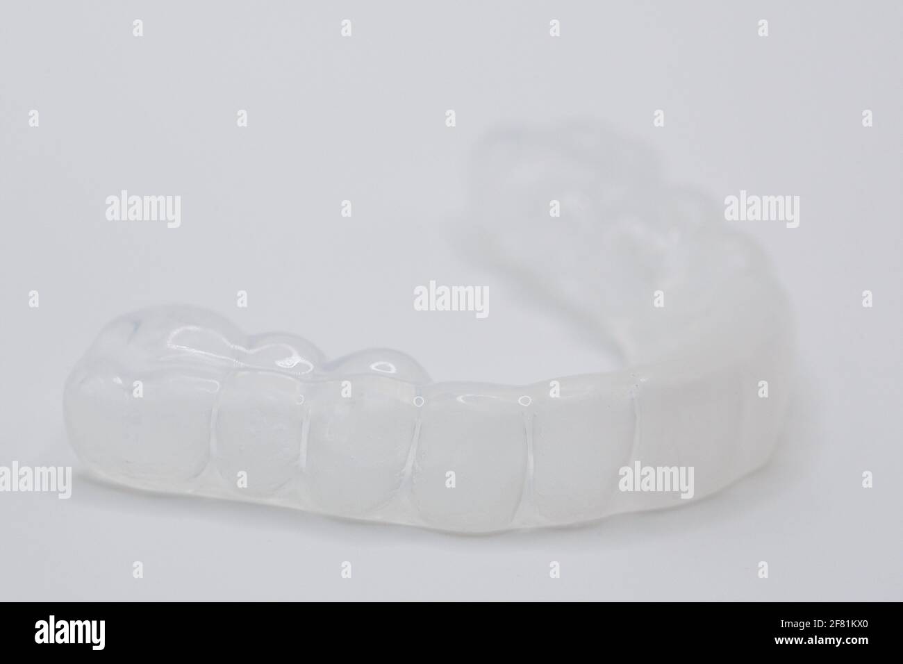 Una protezione per bocca in plastica personalizzata. Foto Stock