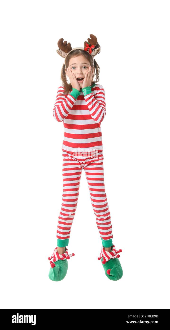 Sorprendo saltando la bambina in costume da elfo di Natale su bianco sfondo  Foto stock - Alamy