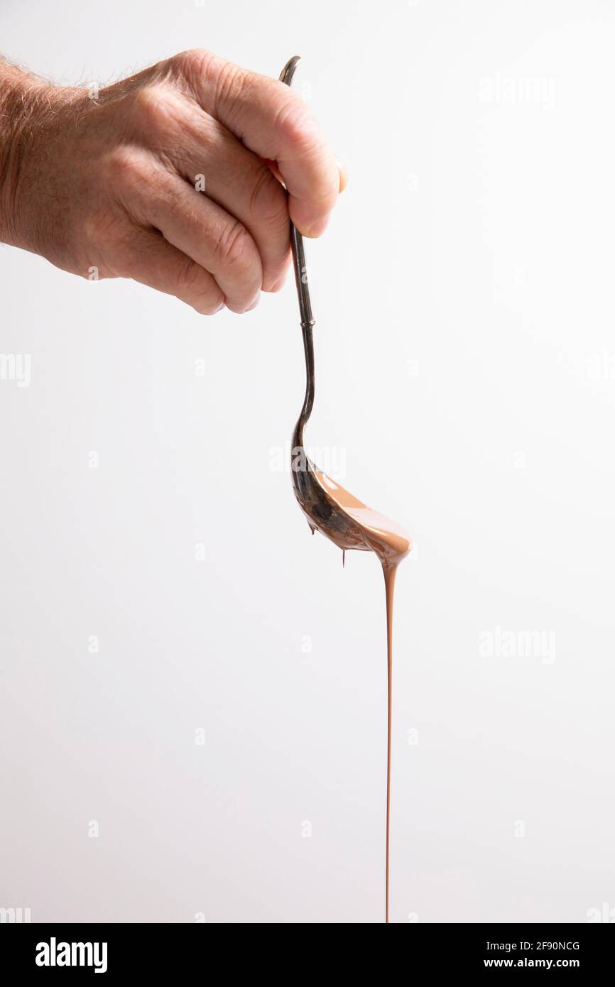 Gocciolamento del cioccolato fuso Foto Stock