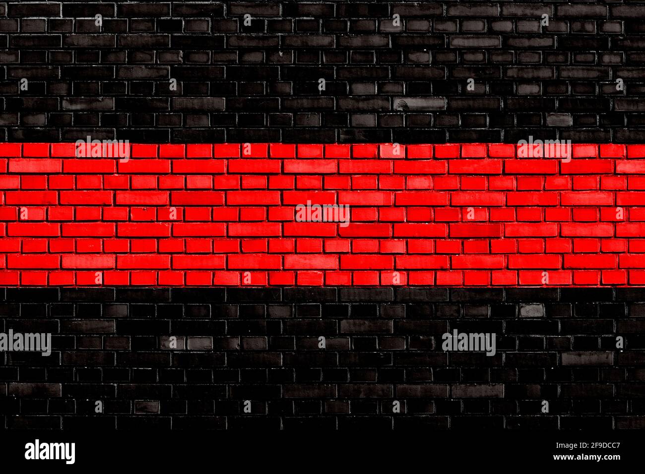 sfondo muro di mattoni di colore rosso nero Foto Stock