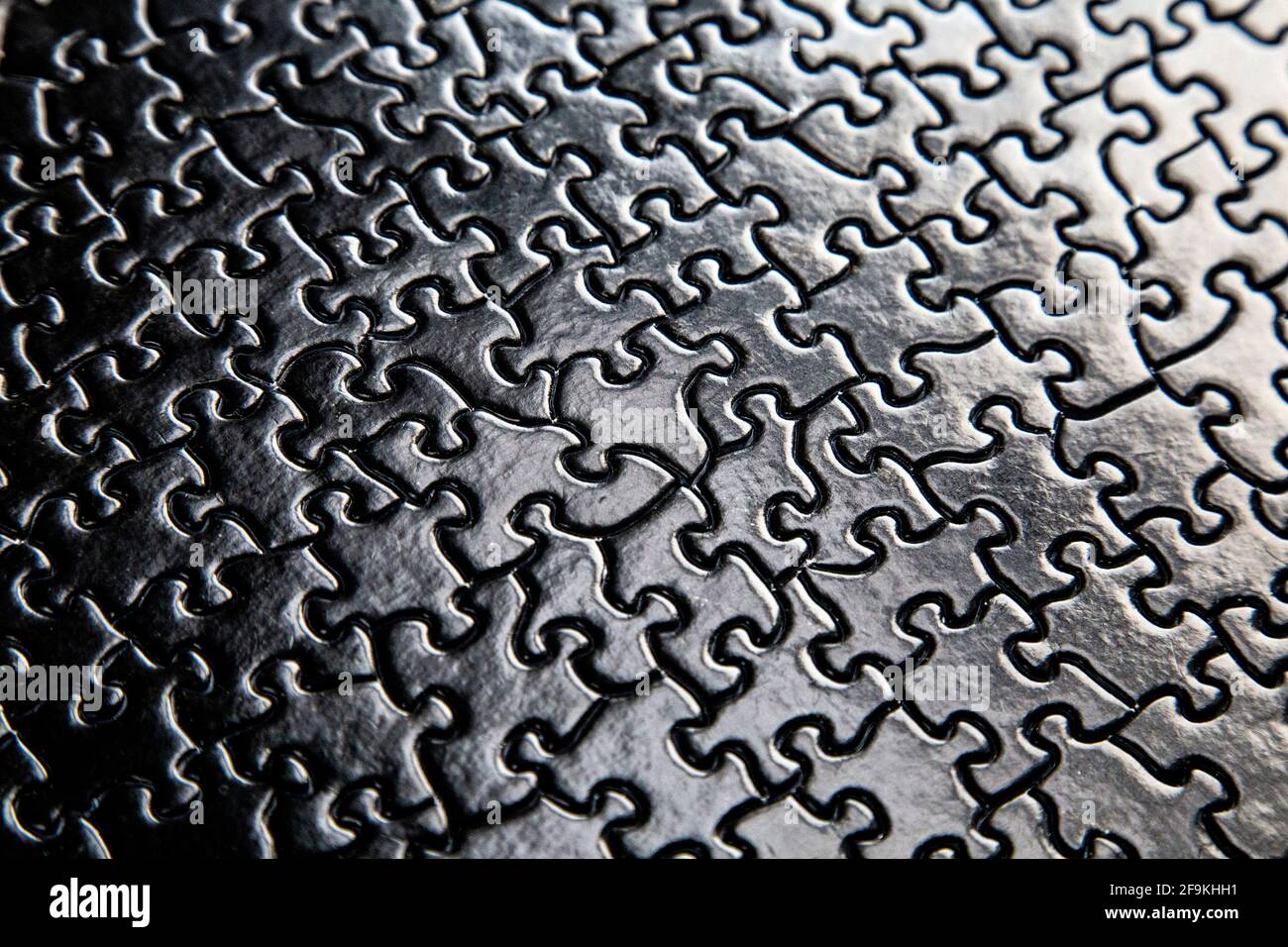Nero puzzle pezzi sfondo Foto Stock