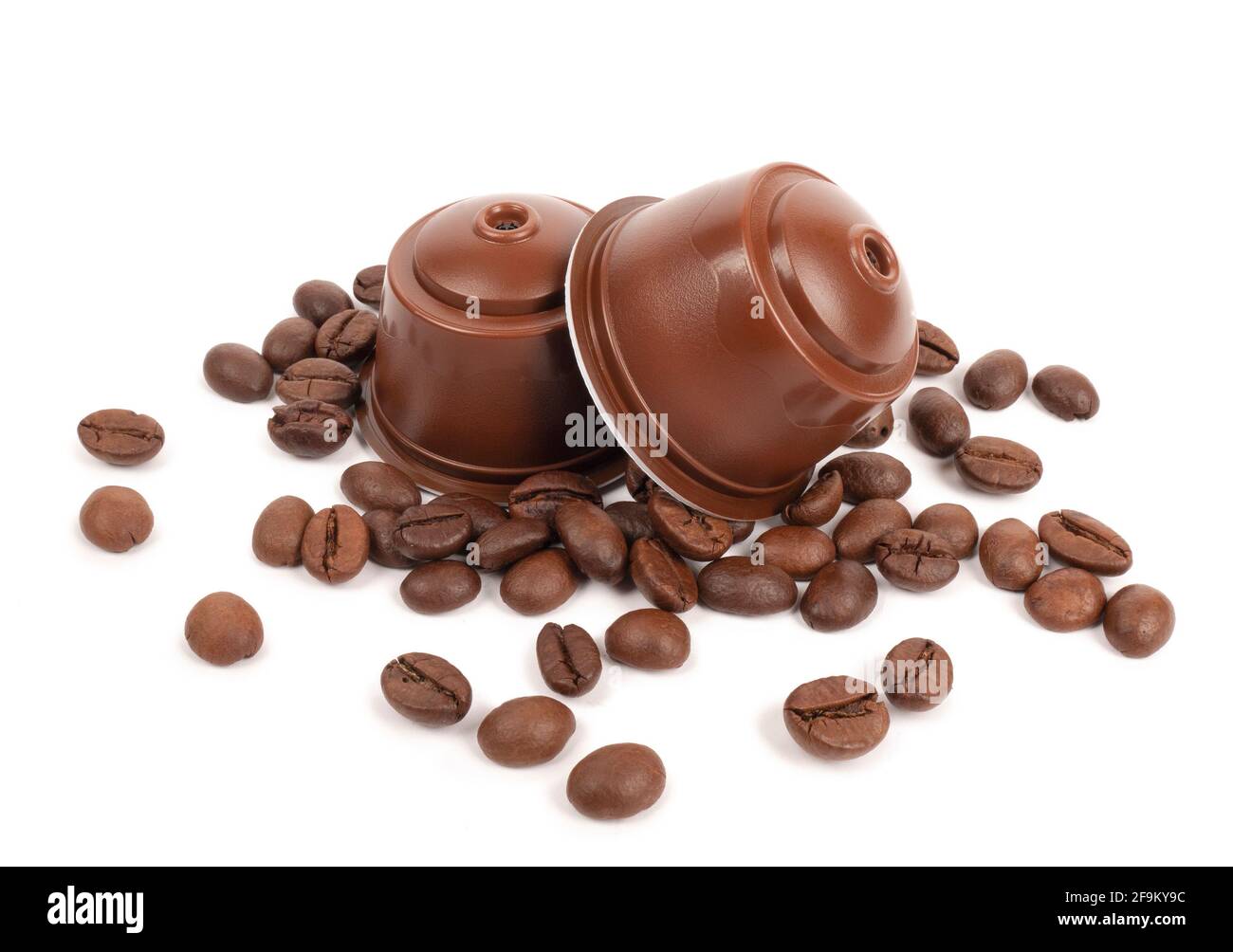 Capsule di caffè espresso e chicchi di caffè bianchi Foto Stock