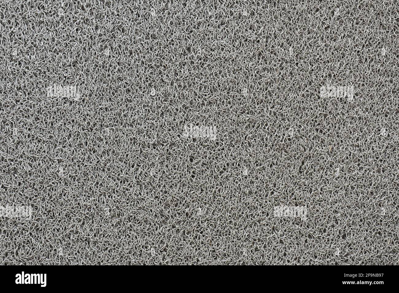 Struttura in fibra sintetica grigia dello scrubber domestico Foto Stock