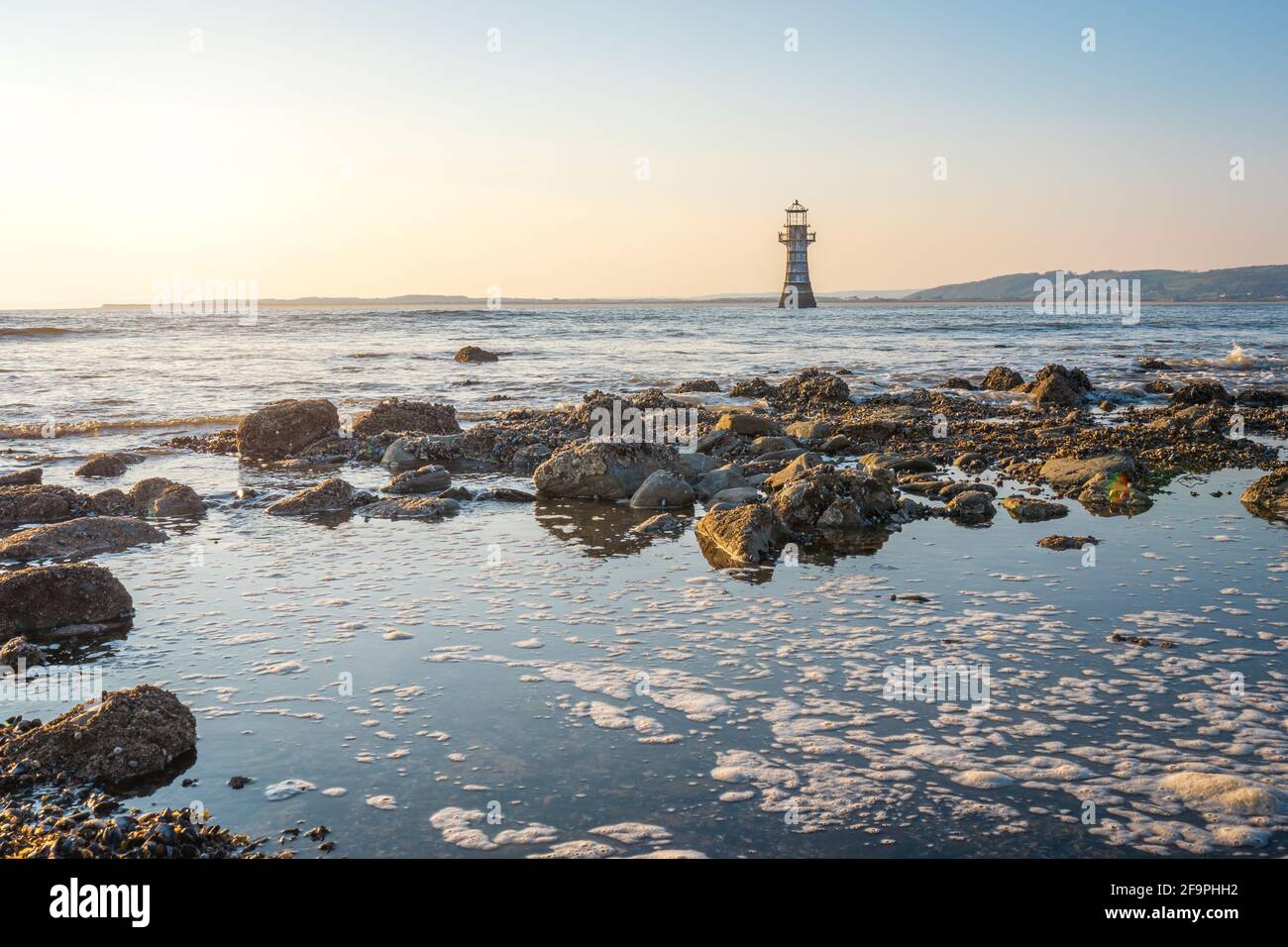 Faro di Whiteford Point vicino a Whiteford Sands al tramonto, la penisola di Gower, Swansea, Galles del Sud, Regno Unito Foto Stock