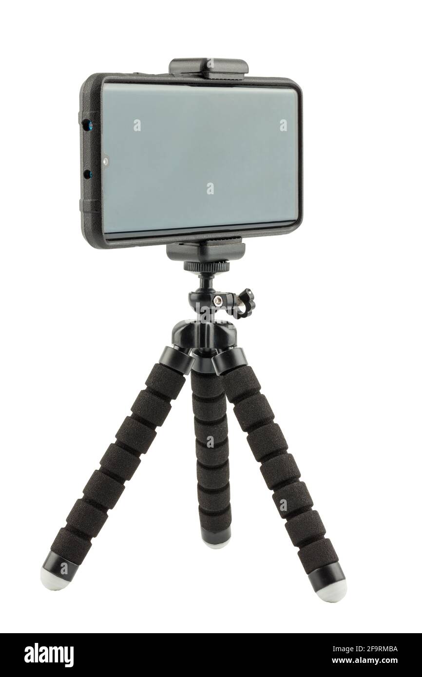 cellulare nero in robusto rivestimento protettivo in gomma su piccolo flessibile treppiede isolato su sfondo bianco Foto Stock