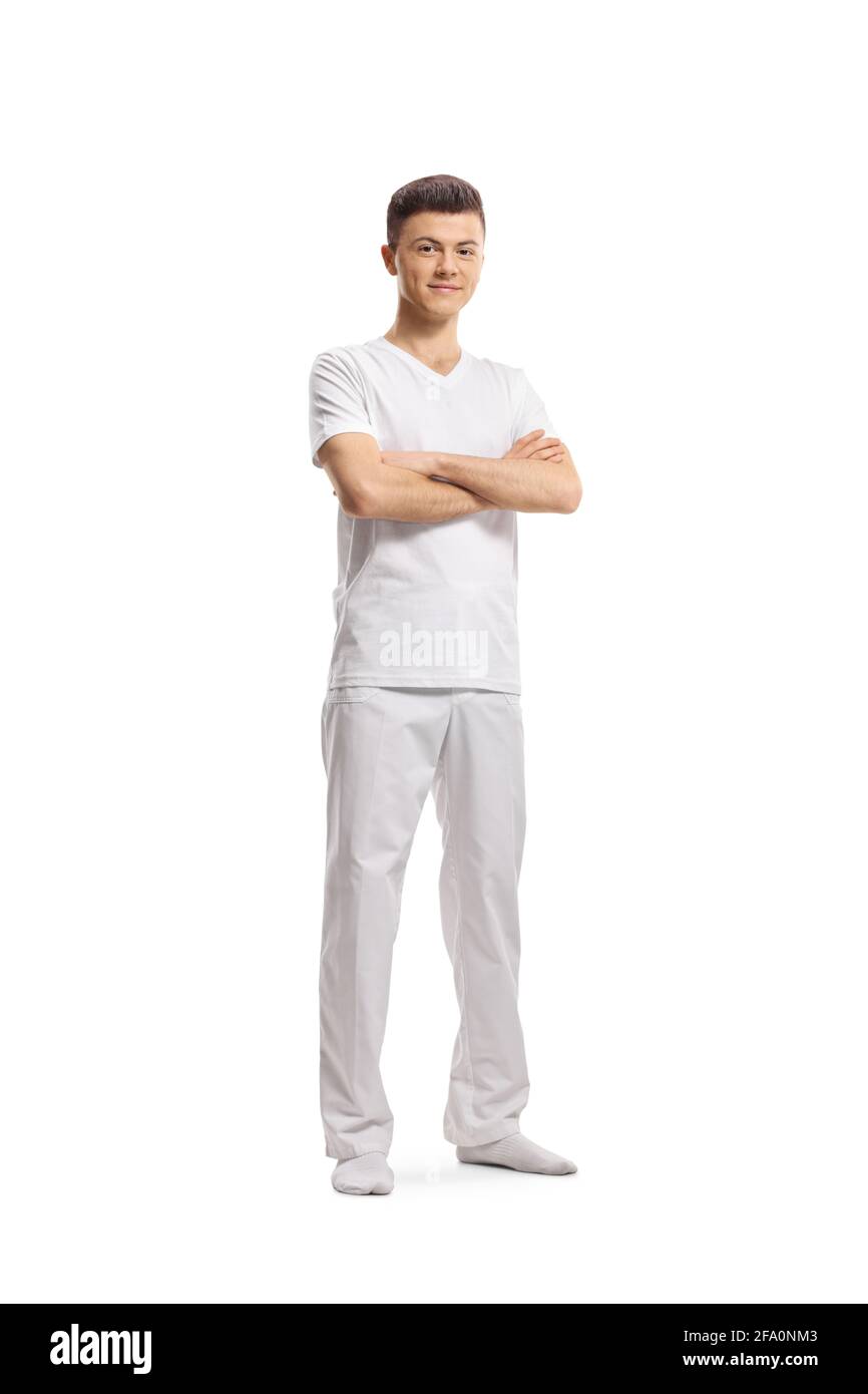 Ritratto a lunghezza intera di un giovane istruttore di yoga maschile isolato su sfondo bianco Foto Stock