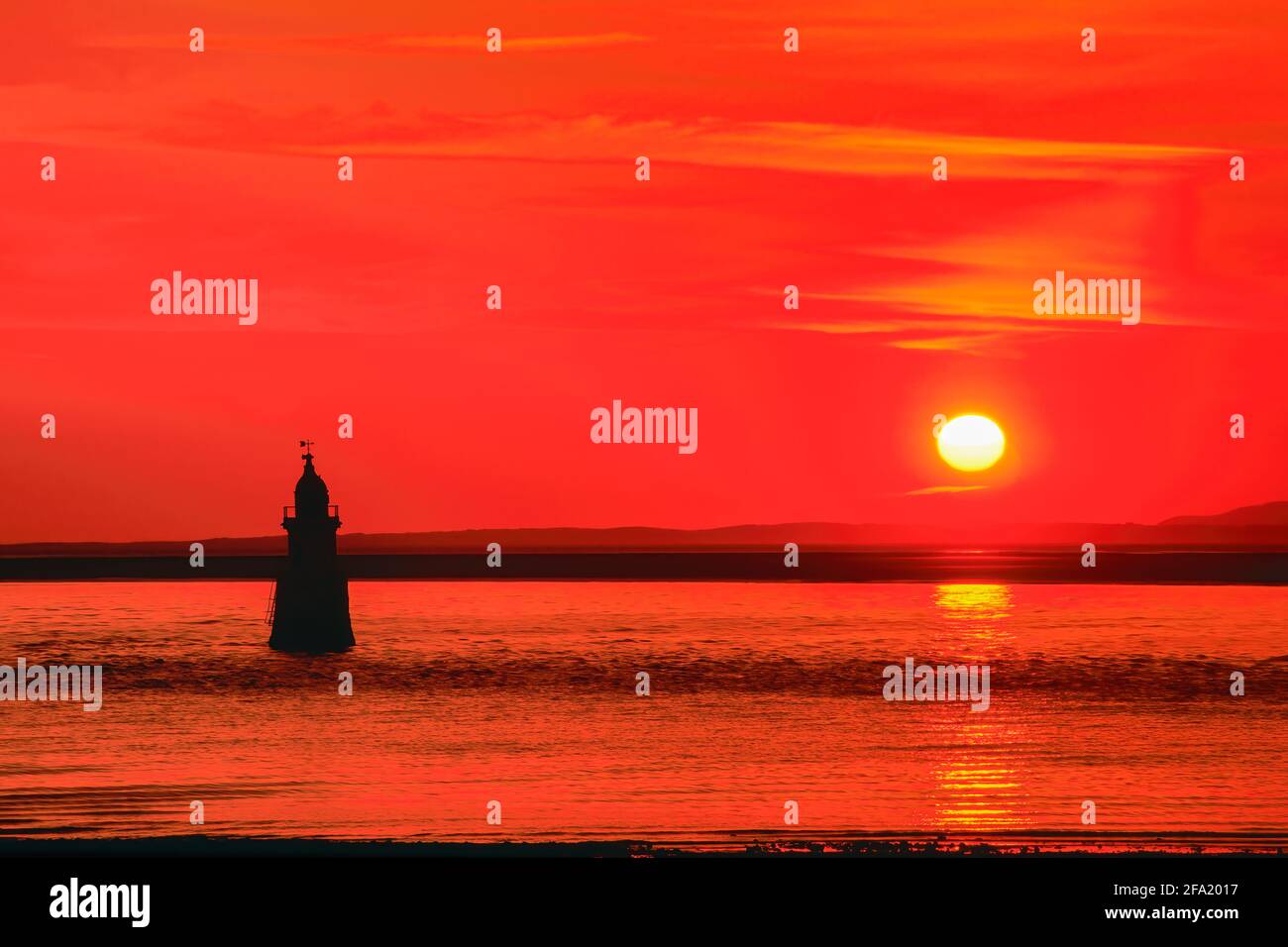 Tramonto al faro di Pover Scar vicino al molo di Glasson nel Lancashire Foto Stock