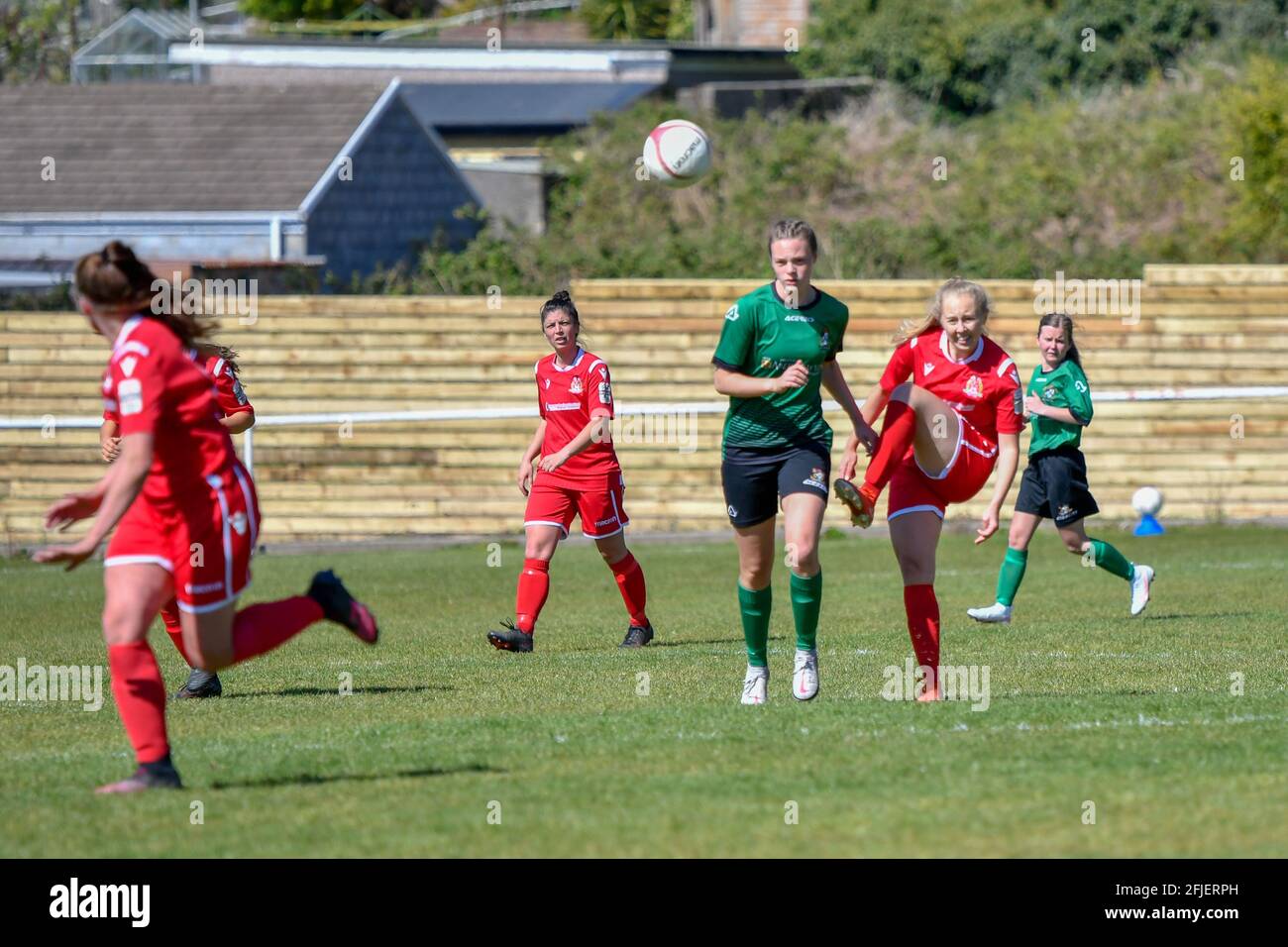 Briton Ferry, Galles. 25 aprile 2021. Lucy Powell di Briton Ferry Llansawel Ladies libera la palla nonostante l'attenzione di un giocatore di Aberystwyth Town Ladies durante la partita di Orchard Welsh Premier Women's League tra Briton Ferry Llansawel Ladies e Aberystwyth Town Ladies al Old Road Welfare Ground di Briton Ferry, Galles, Regno Unito, il 25, Aprile 2021. Credit: Duncan Thomas/Majestic Media/Alamy Live News. Foto Stock Briton Ferry, Galles. 25 aprile 2021. Lucy Powell di Briton Ferry Llansawel Ladies libera la palla nonostante l'attenzione di un giocatore di Aberystwyth Town Ladies durante la partita di Orchard Welsh Premier Women's League tra Briton Ferry Llansawel Ladies e Aberystwyth Town Ladies al Old Road Welfare Ground di Briton Ferry, Galles, Regno Unito, il 25, Aprile 2021. Credit: Duncan Thomas/Majestic Media/Alamy Live News. Foto Stock