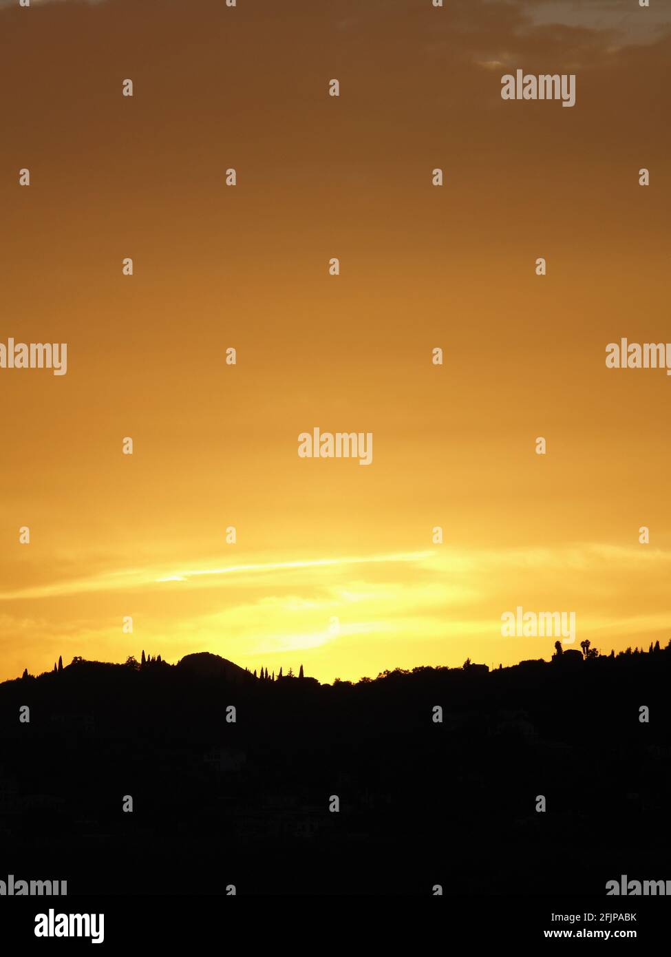 Tramonto dorato a Kanoni, Corfù, Grecia Foto Stock