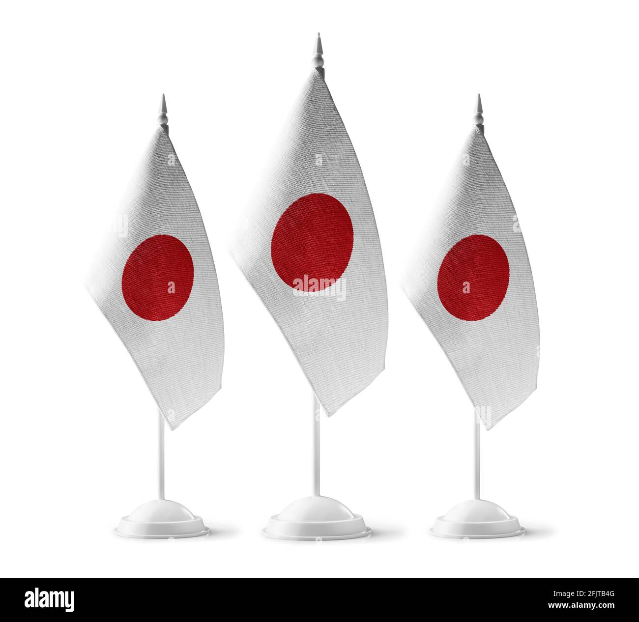 Piccole bandiere nazionali del Giappone su sfondo bianco Foto Stock