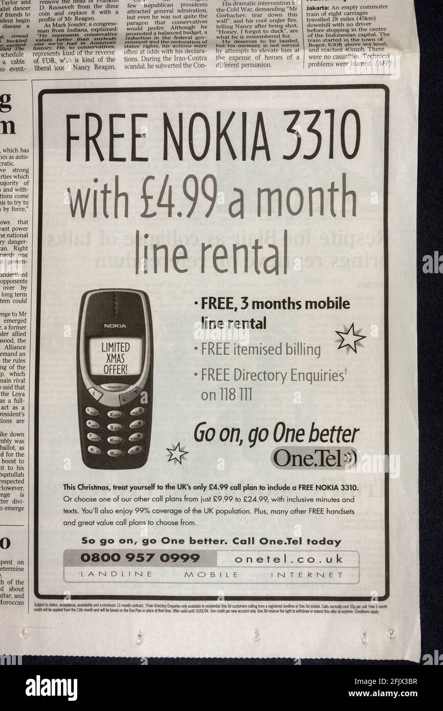 Annuncio per il noleggio di una linea telefonica one.Tel (con Nokia 3310 gratuito) all'interno del giornale Times UK il 15 dicembre 2003. Foto Stock