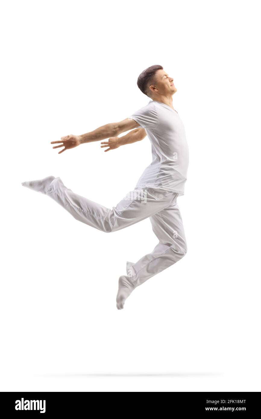 Ragazzo in abiti bianchi che balla un balletto moderno isolato sopra sfondo bianco Foto Stock