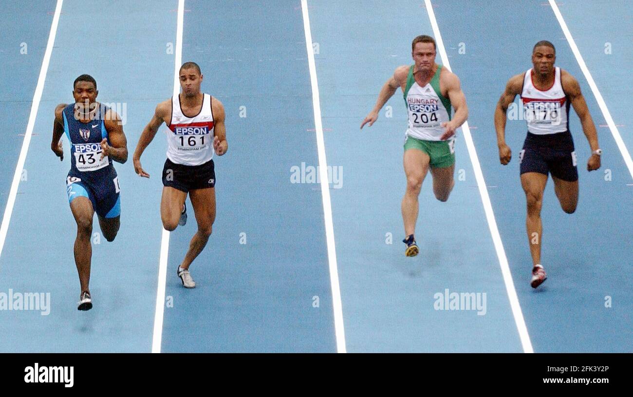 IL 9° CAMPIONATO MONDIALE INDOOR IAAF PRESSO LA NATIONAL INDOOR ARENA DI BIRMINGHAM. IL MENS 60M L-R JUSTIN GATLIN (USA) JASON GARDNER (GBR) GABOR DOBOS (HUN) MARCHIO LEWIS-FRANCIS 14/3/2003 IMMAGINE DAVID ASHDOWN Foto Stock