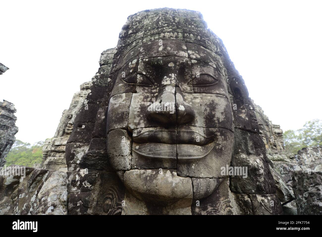 Facce di pietra al tempio di Bayon a Siem Reap, Cambogia. Foto Stock