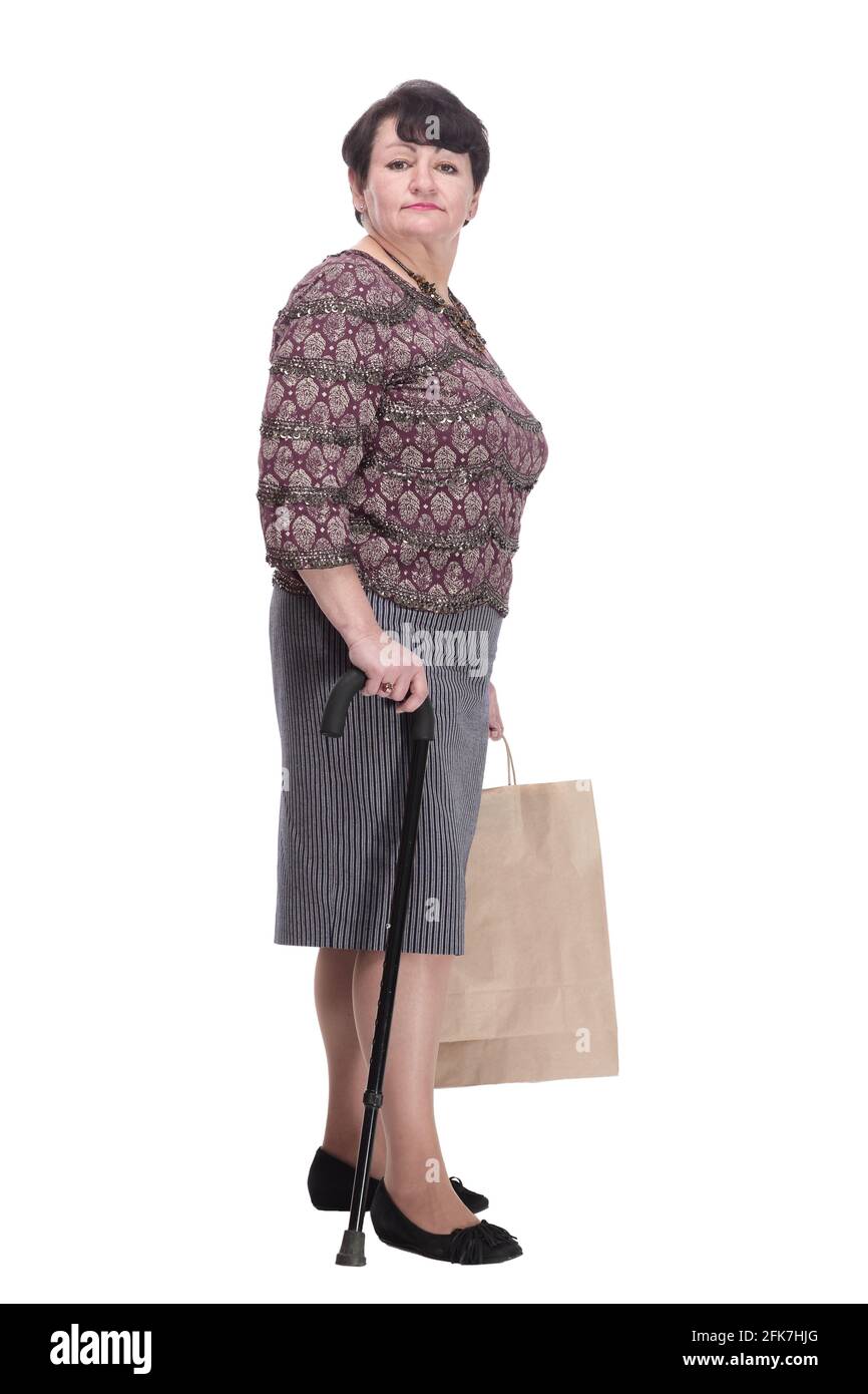 donna anziana con bastone da passeggio e borse per la spesa Foto stock -  Alamy