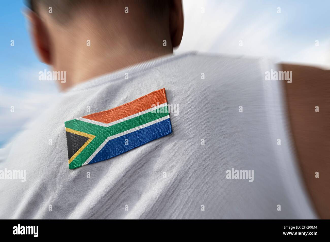 La bandiera nazionale del Sud Africa sulla schiena dell'atleta Foto Stock