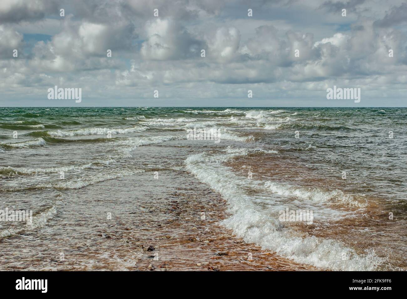 Sunny estate day by Baltic Sea copy space for text Travel agency.Wandelust Travel background.Power of water Energy passing.Amazing view of cold Sea, w Foto Stock