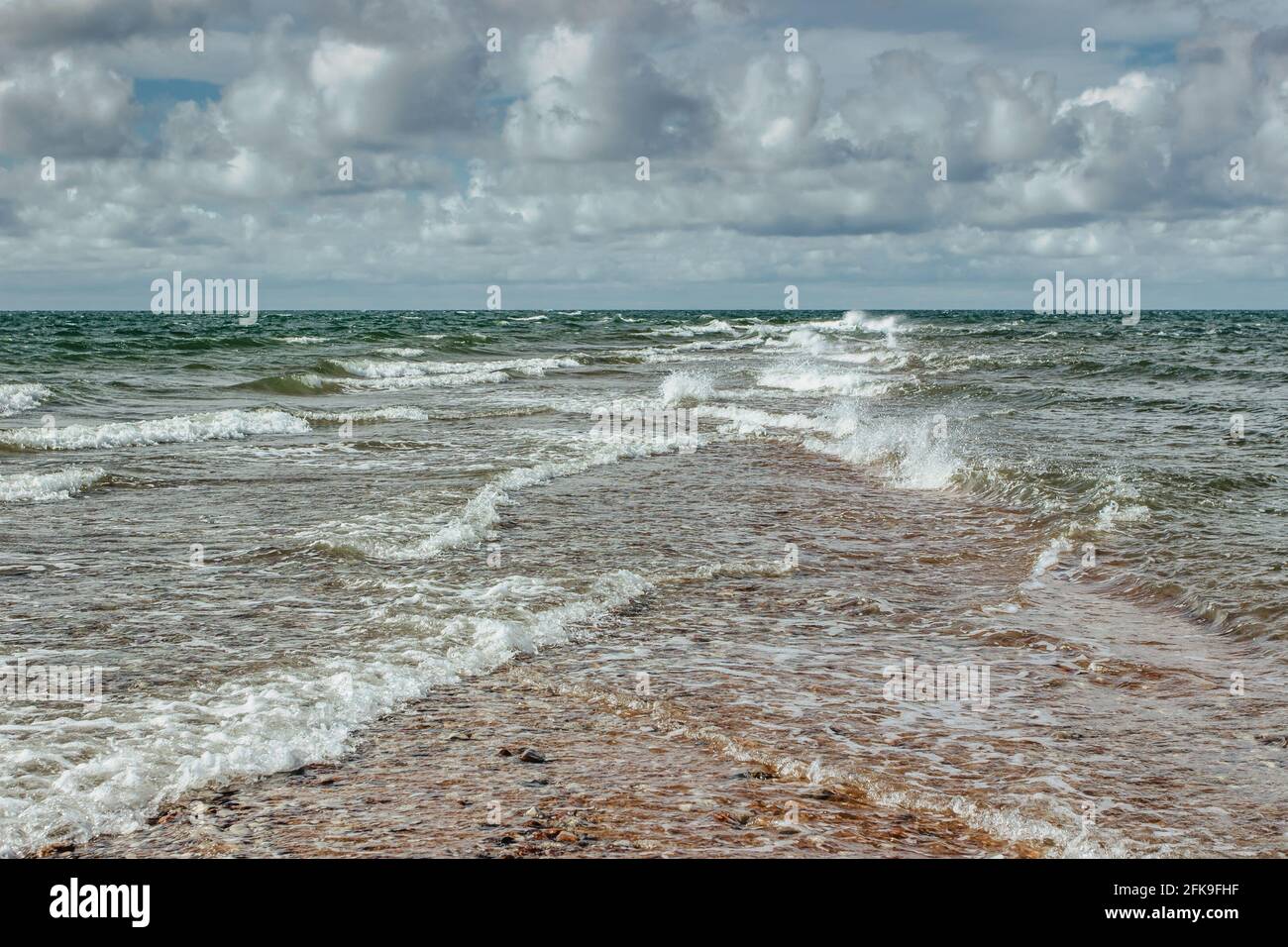 Sunny estate day by Baltic Sea copy space for text Travel agency.Wandelust Travel background.Power of water Energy passing.Amazing view of cold Sea, w Foto Stock