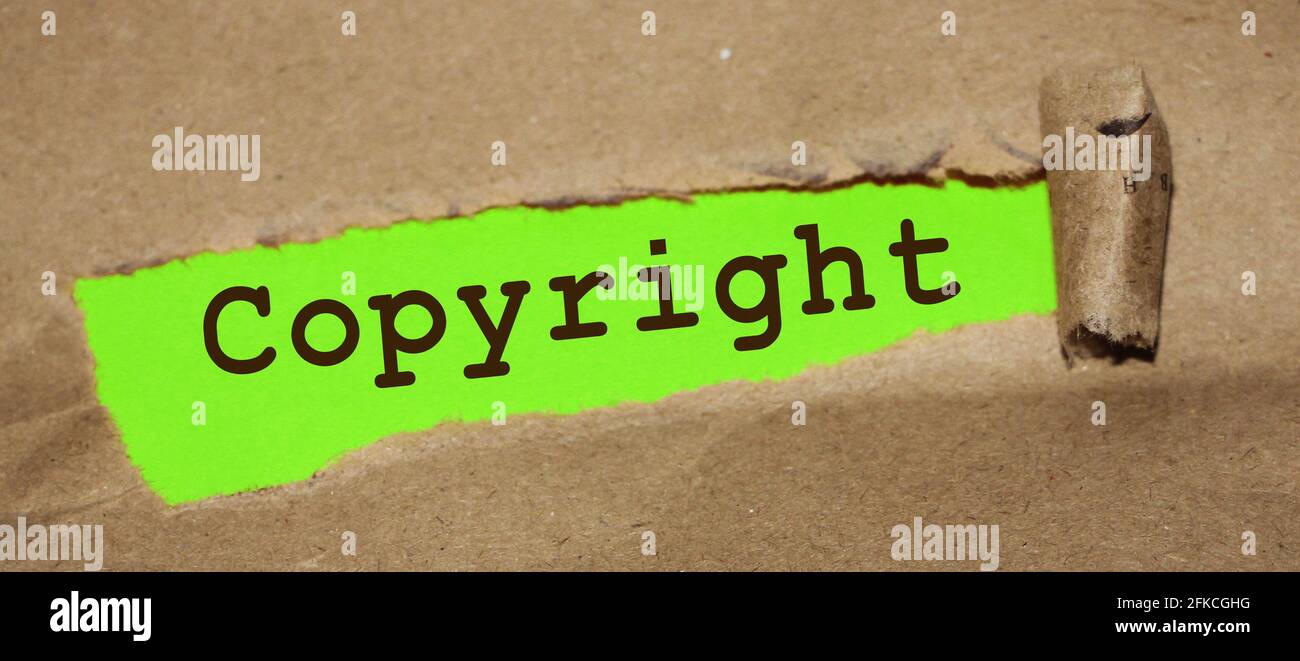 Carta strappata di uner di parola del copyright. Marcatura legale del marchio, concetto aziendale. Foto Stock