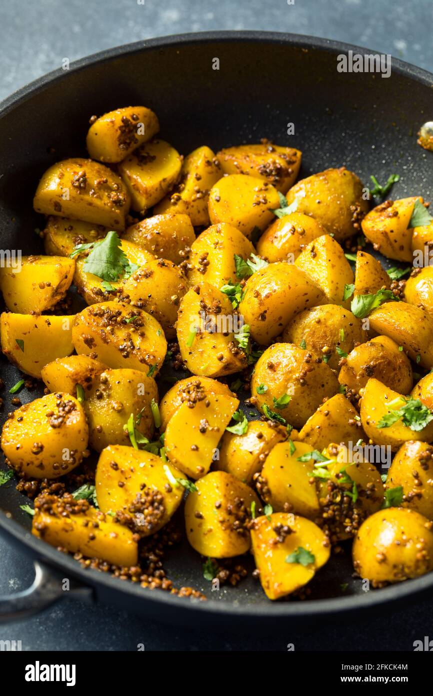 Patate di semina arrosto fatte in casa con Cilantro Foto Stock