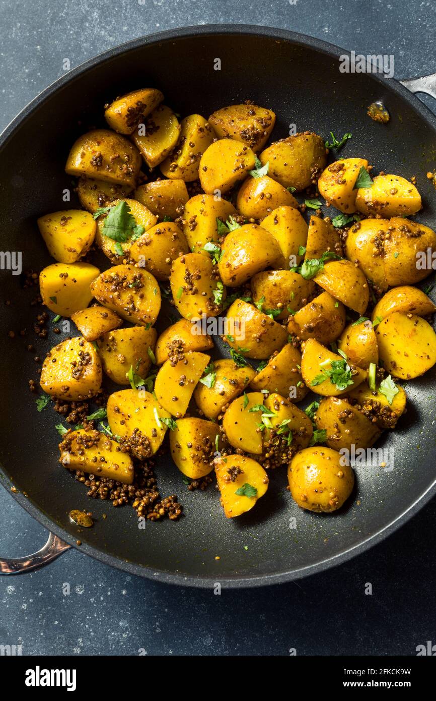 Patate di semina arrosto fatte in casa con Cilantro Foto Stock