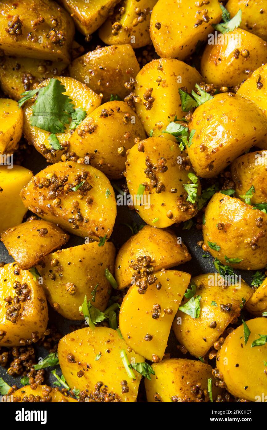 Patate di semina arrosto fatte in casa con Cilantro Foto Stock