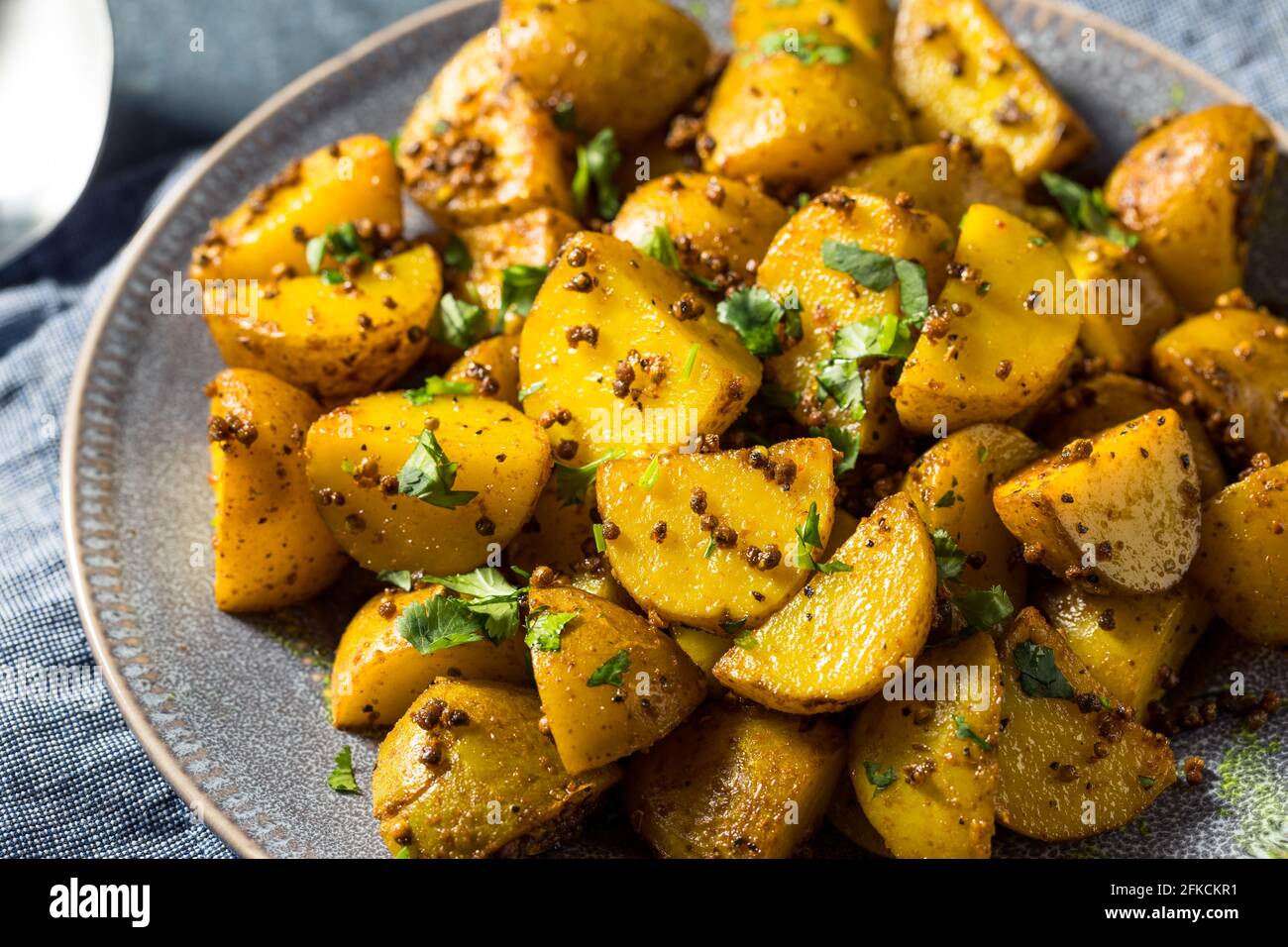 Patate di semina arrosto fatte in casa con Cilantro Foto Stock