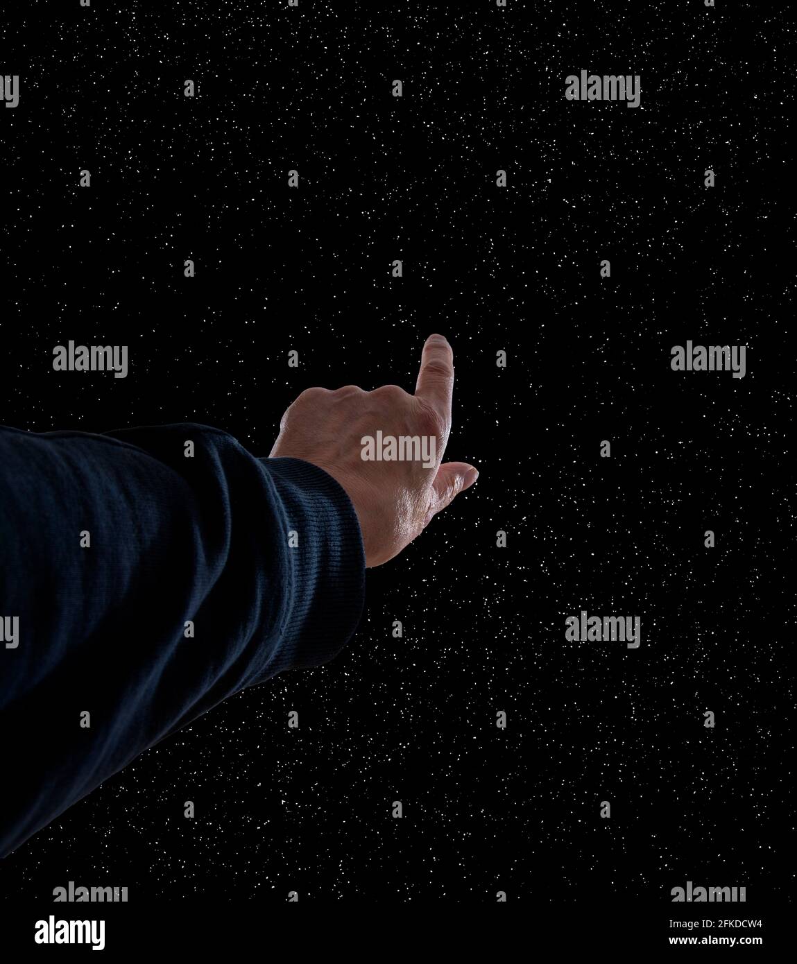 Mano che punta verso il cielo Foto Stock