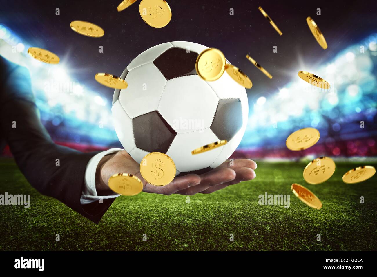 Scommesse sportive. Pioggia di soldi su una palla di calcio tenuta dalla mano di un uomo d'affari in uno stadio di calcio Foto Stock